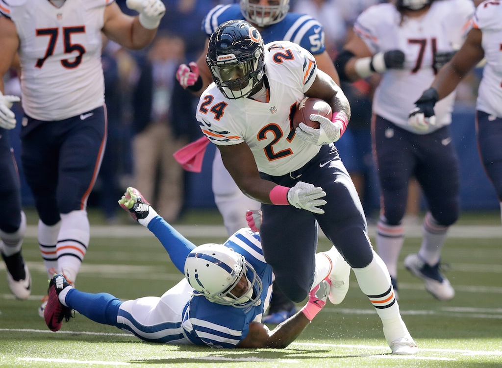 Jordan Howard breaks a tackle. Jordan Howard carries the ball against the Colts.