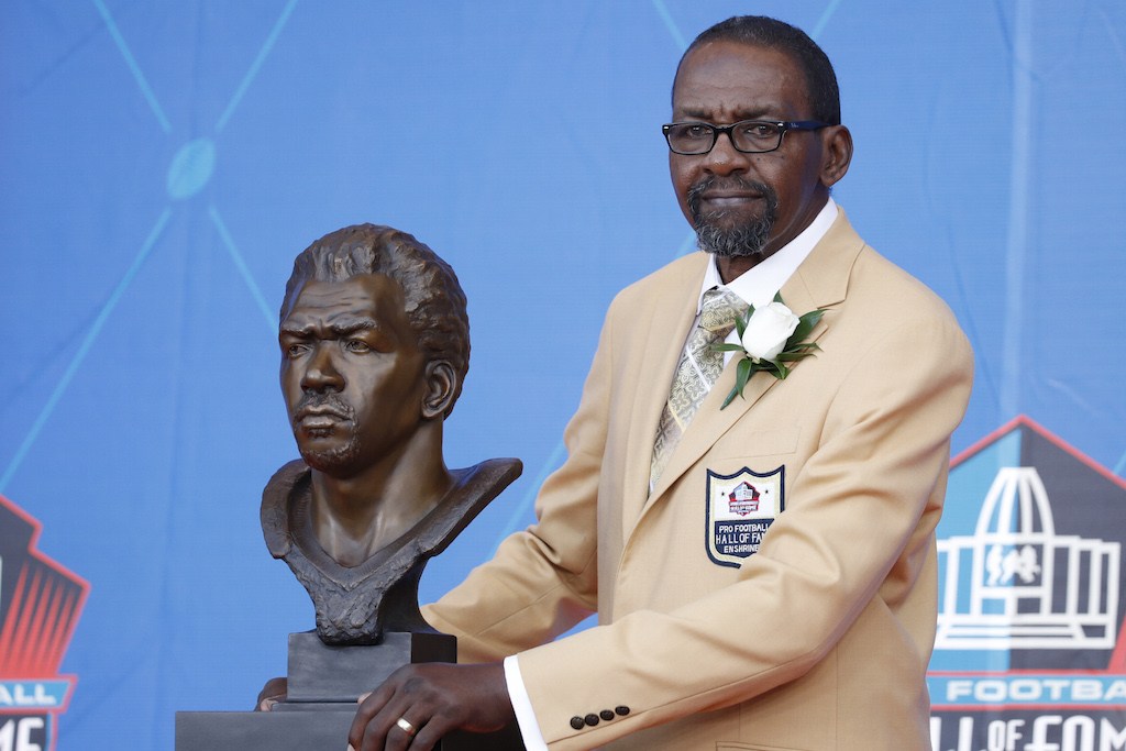 Kenny Easley poses with his bust.