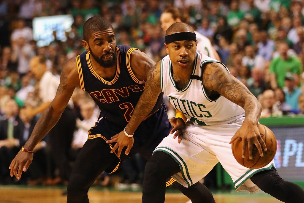 Kyrie Irving goes for the steal against Isaiah Thomas.