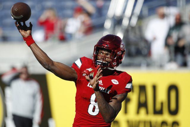Lamar Jackson fires a pass during warm ups. Lamar Jackson warms up.