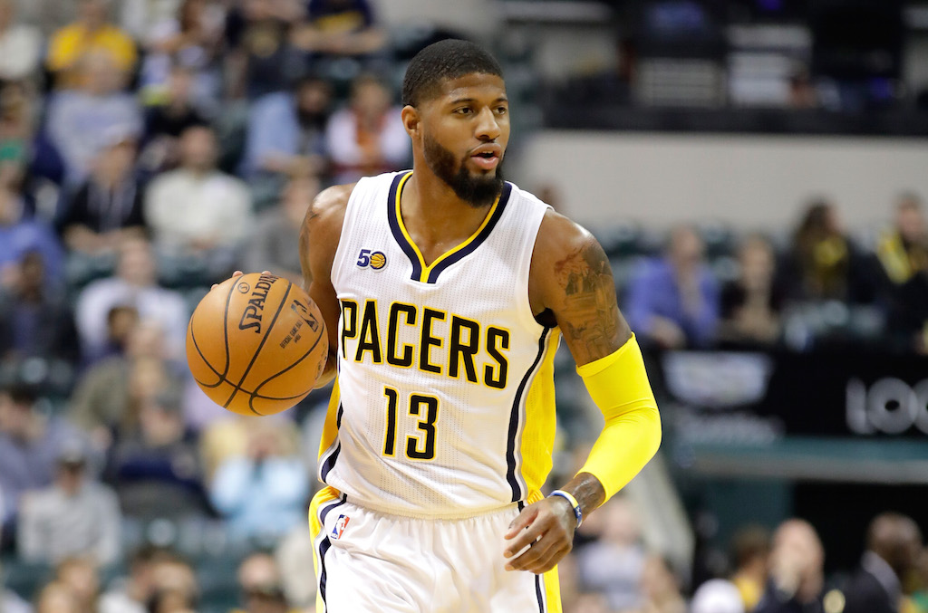 Paul George dribbles the ball. Paul George brings up the ball.