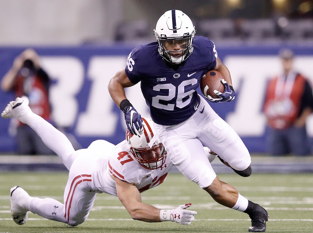 Saquon Barkley runs with the ball. Saquon Barkley carries the ball against Wisconsin.