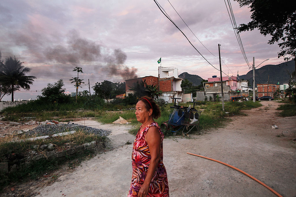 Resident Marize do Amor Divino, who said she was diagnosed with the Zika virus two weeks ago, walks in the mostly demolished Vila Autodromo favela community Rio de Janeiro, Brazil. Resident Marize do Amor Divino, who said she was diagnosed with the Zika virus two weeks ago, walks in the mostly demolished Vila Autodromo favela community Rio de Janeiro, Brazil.