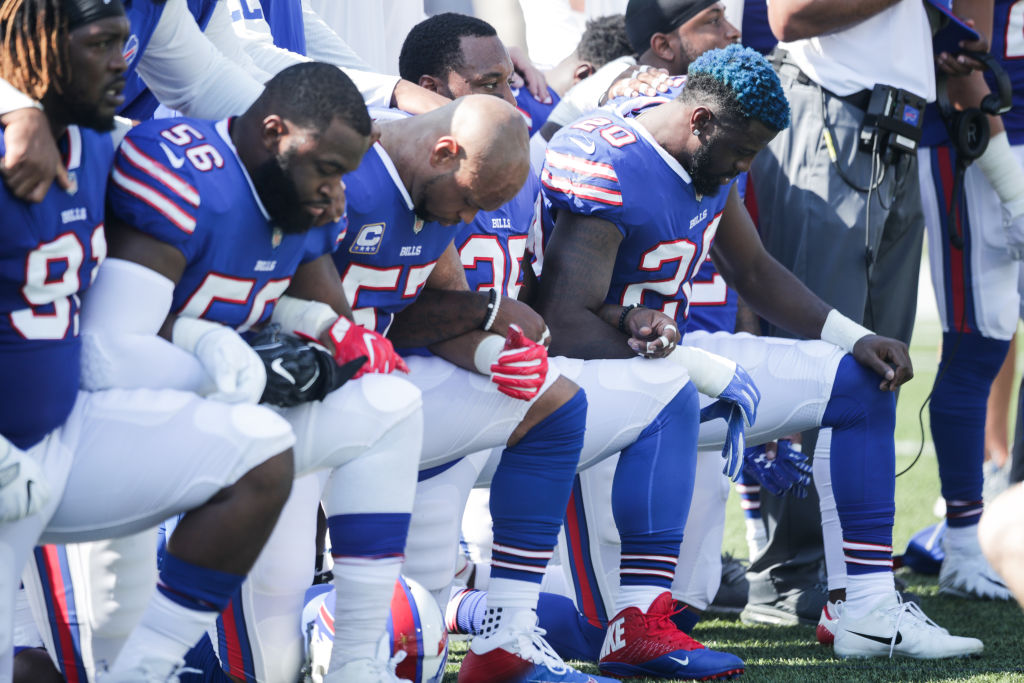 Members of the Buffalo Bills kneel in protest of police brutality. buffalo bills protesting