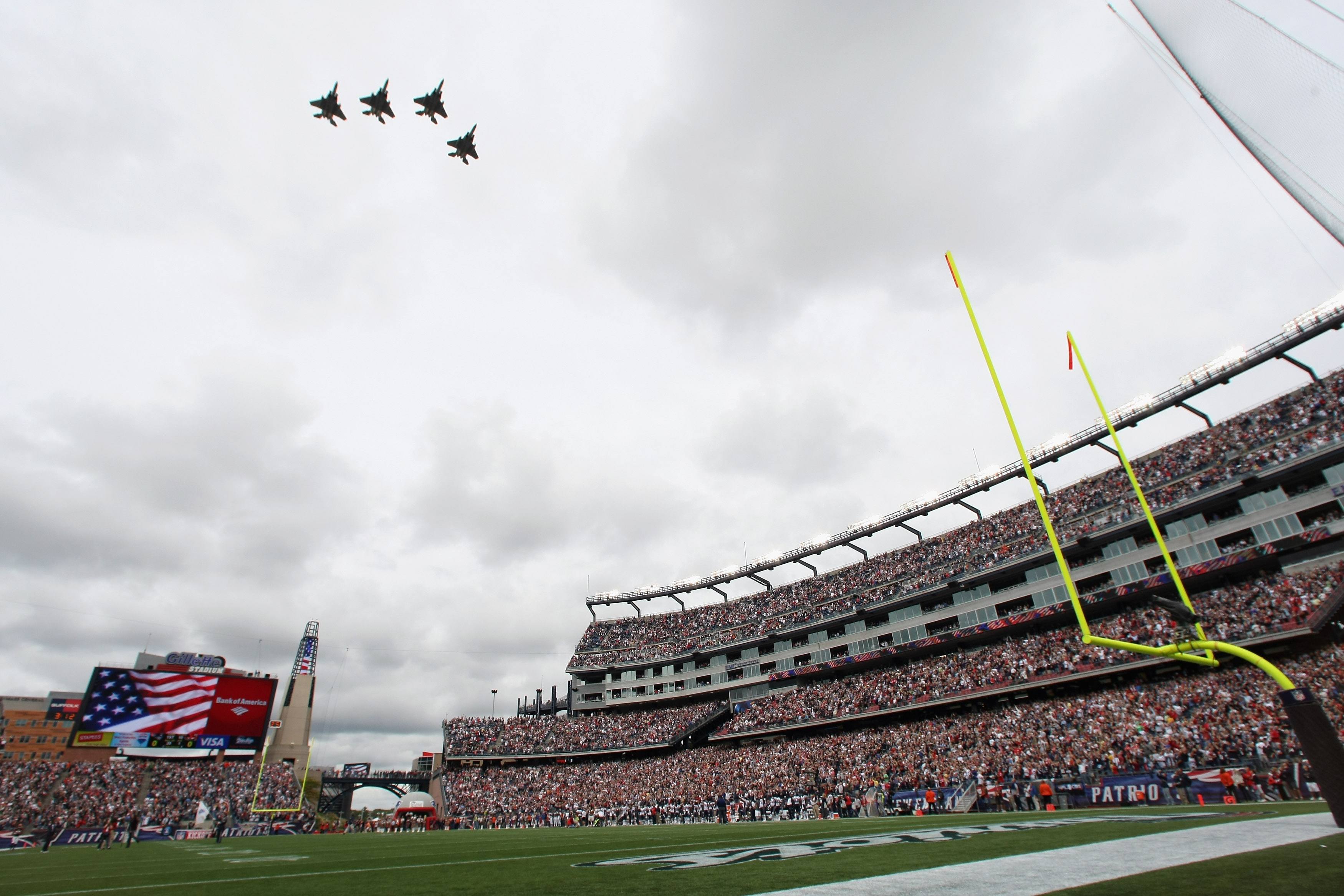 Jets flying over football field