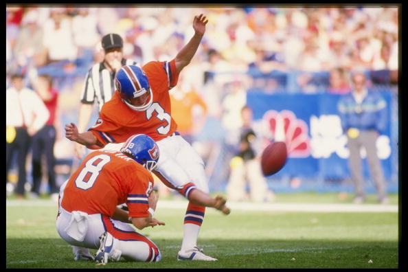Kicker Rich Karlis of the Denver Broncos kicks the ball during a game against the New England Patriots at Mile High Stadium.