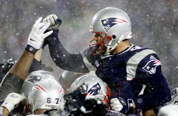 Field kicker Adam Vinatieri of the New England Patriots celebrates after making a field goal in overtime against the Oakland Raiders in their AFC playoff game. Field kicker Adam Vinatieri of the New England Patriots celebrates after making a field goal in overtime against the Oakland Raiders in their AFC playoff game.