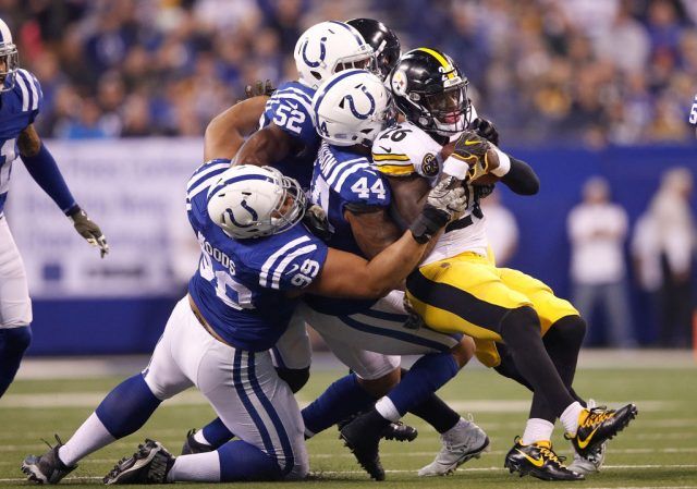 Le'Veon Bell being taken down by 4 defensive players Le'Veon Bell being taken down by 4 defensive players