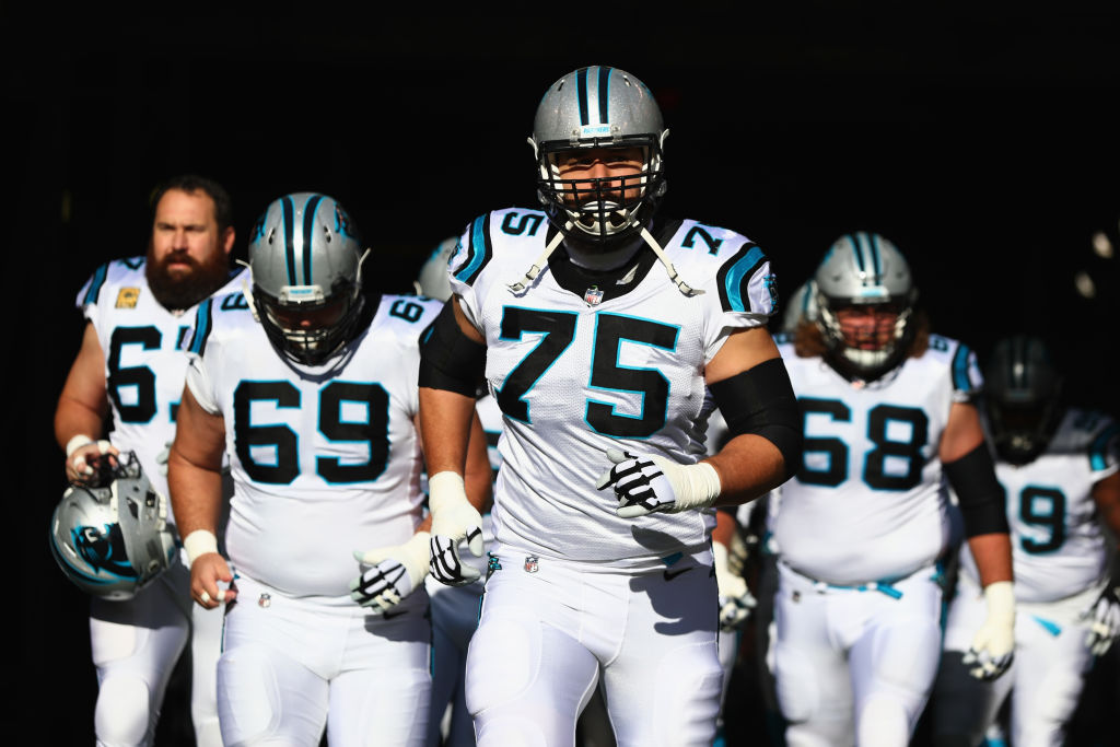 EAST RUTHERFORD, NJ - NOVEMBER 26: Offensive tackle Matt Kalil #75, center Tyler Larsen #69, offensive guard Andrew Norwell #68 and teammates take the field before playing against the New York Jets during the first quarter of the game at MetLife Stadium on November 26, 2017 in East Rutherford, New Jersey. the new york jets