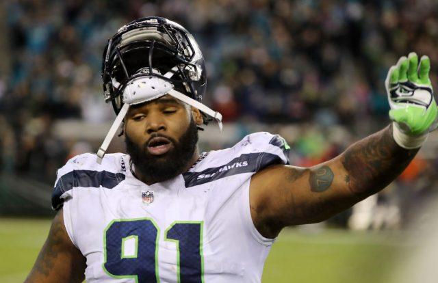 Sheldon Richardson holds his hand up