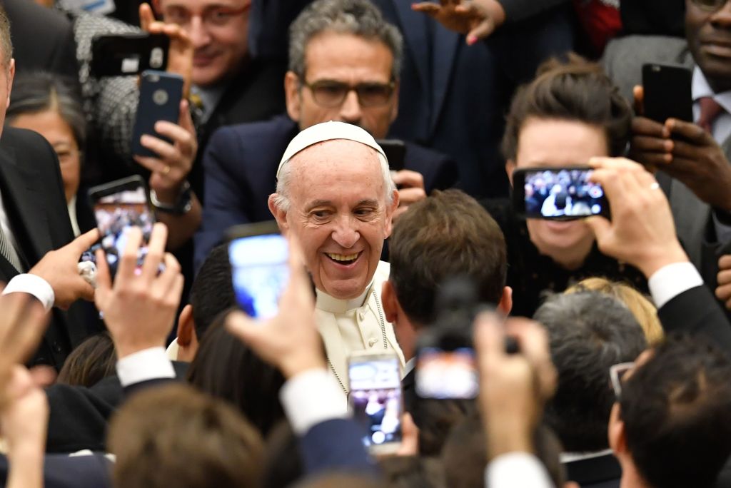 people taking pictures of pope francis on their phones