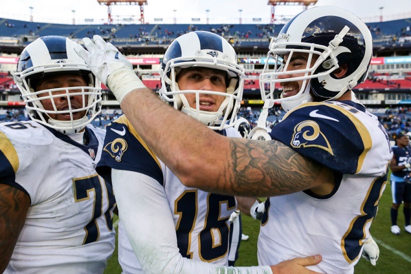 NASHVILLE, TN - DECEMBER 24: Tight End Derek Carrier #86, Quarterback Jared Goff #16 and Tight End Tyler Higbee #89 of the Los Angeles Rams celebrate following their win against the Tennessee Titians at Nissan Stadium on December 24, 2017 in Nashville, Tennessee.
