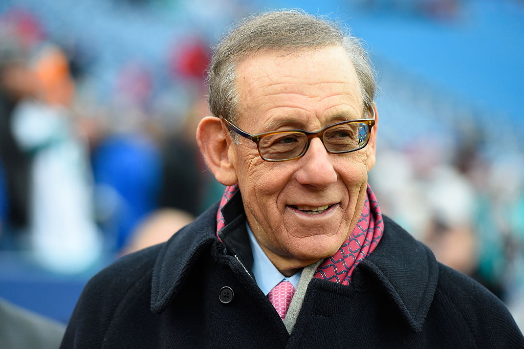 Owner of the Miami Dolphins Stephen M. Ross watches his team warm up before the game