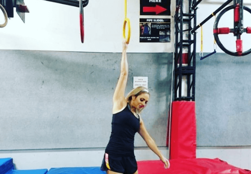 Elizabeth Swaney training in a gym. 