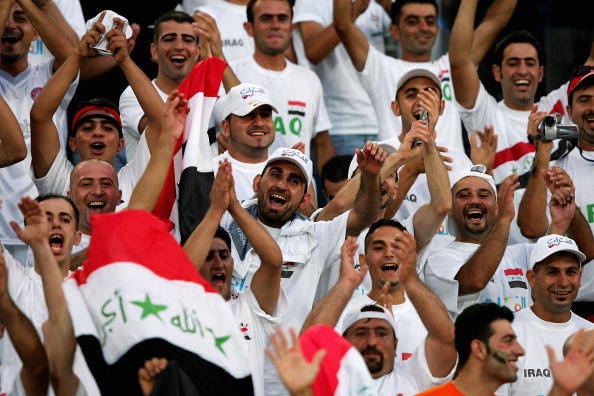 Iraqi soccer fans cheer their team before they compete in the men's football preliminary match between Iraq and Portugal during the Athens 2004 Summer Olympic Games at Pampeloponnisiako Stadium. Iraqi soccer fans cheer their team before they compete in the men's football preliminary match between Iraq and Portugal during the Athens 2004 Summer Olympic Games at Pampeloponnisiako Stadium.