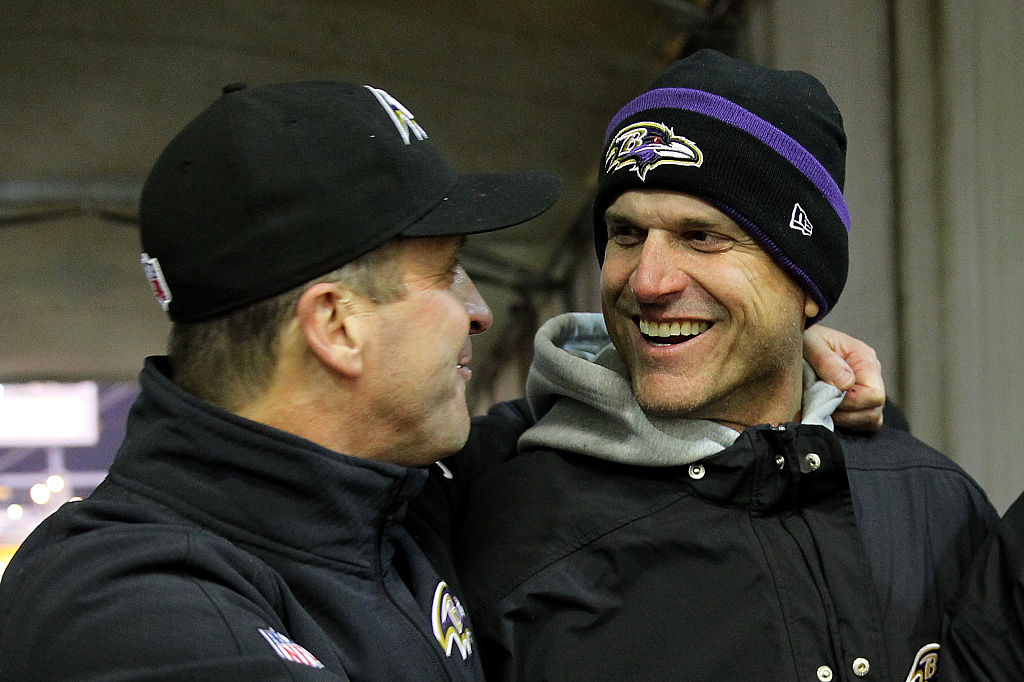 Jim Harbaugh (R) with his brother, head coach John Harbaugh (L)