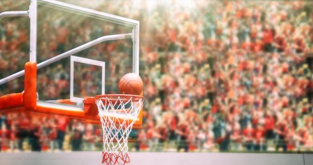 A ball going through a basketball hoop. A ball going through a basketball hoop.