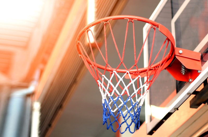 A red, white and blue colored basketball hoop. A red, white and blue colored basketball hoop.