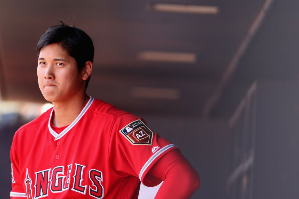 Shohei Ohtani #17 of the Los Angeles Angels in the dugout during the spring training game against the San Diego Padres at Peoria Stadium on February 26, 2018 in Peoria, Arizona.