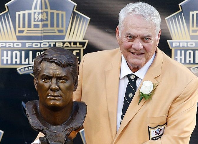 Mick Tingelhoff poses with his bust during the NFL Hall of Fame induction ceremony