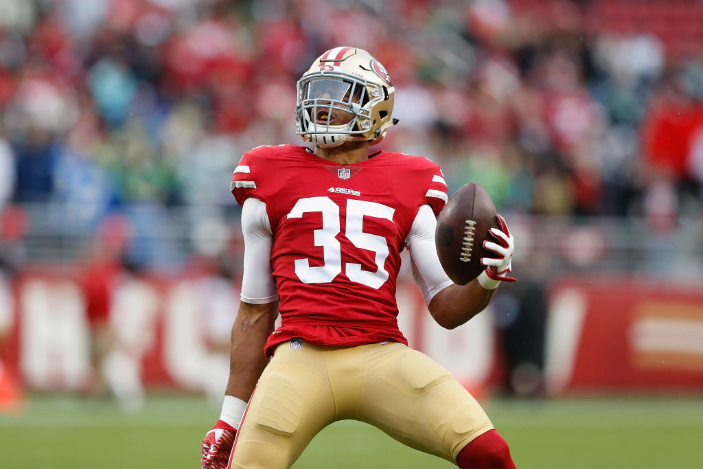 Eric Reid #35 celebrates after intercepting a pass against the Seattle Seahawks