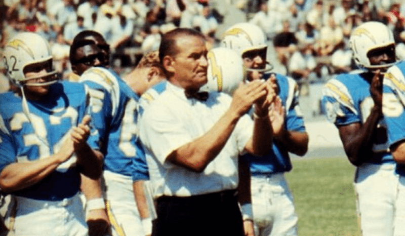 Sid Gillman clapping his hands on the field. Sid Gillman clapping his hands on the field.