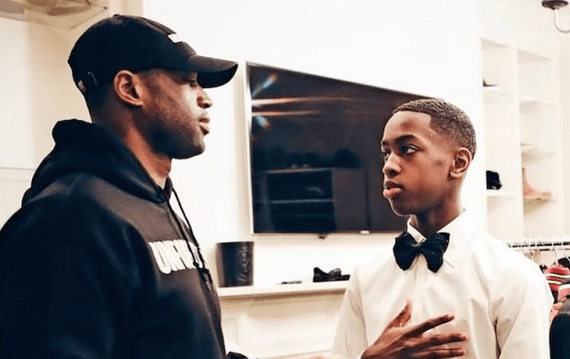 Dwayne and Zaire talking inside a room. Dwayne and Zaire talking inside a room.
