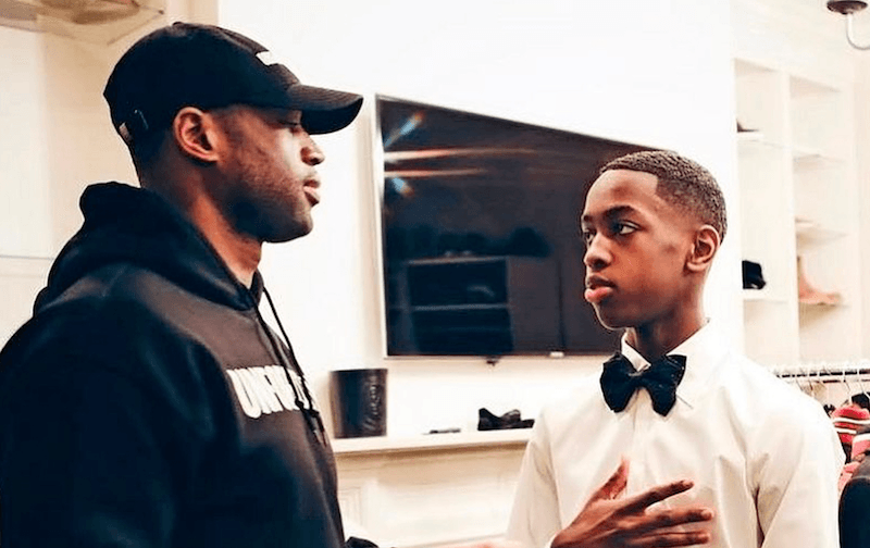 Dwayne and Zaire talking inside a room. Dwayne and Zaire talking inside a room.