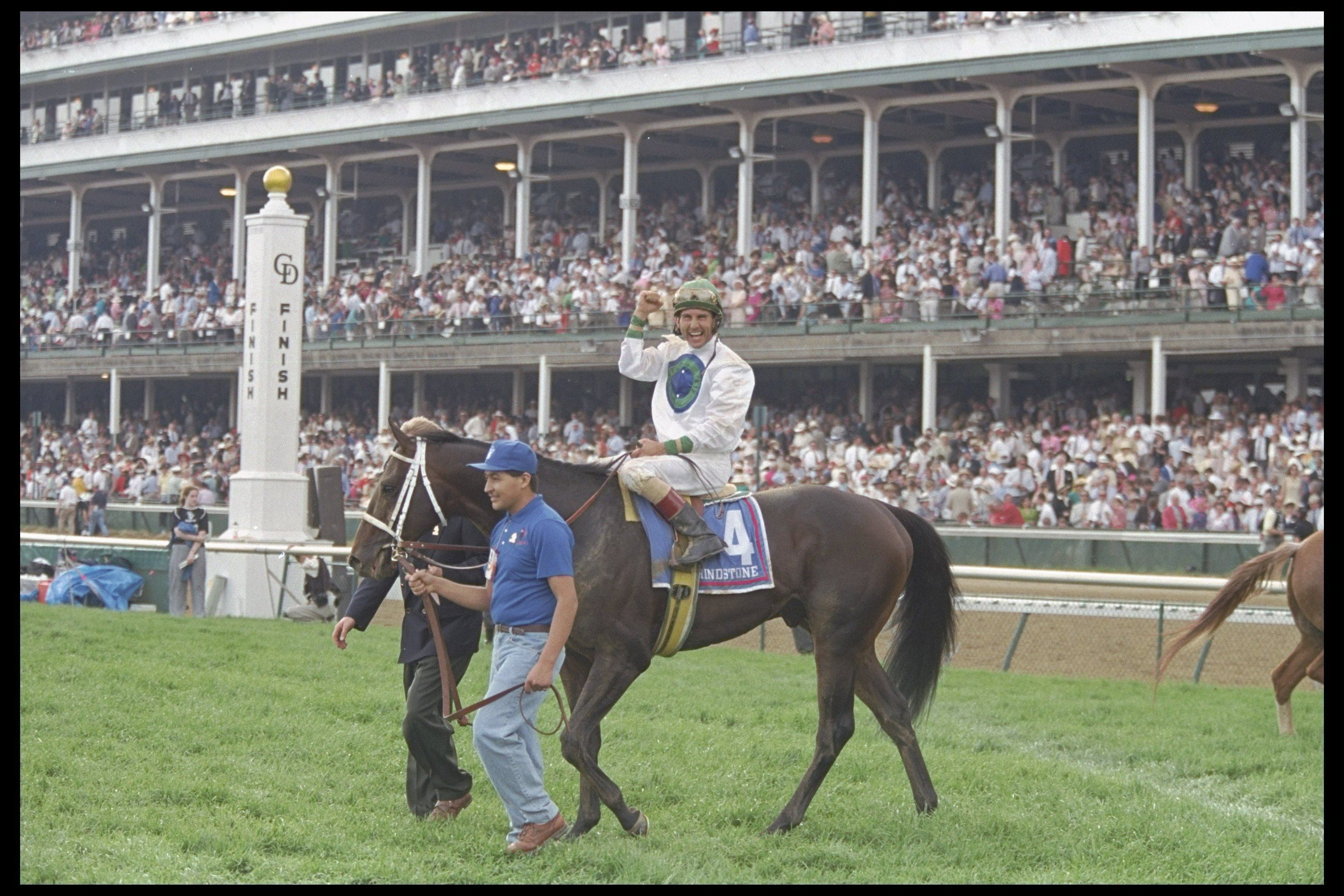Jerry Bailey on Grindstone waves to the crowds