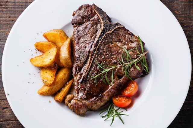 Steak on a white plate. Steak on a white plate.