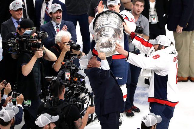 Alex Ovechkin holding up the cup. Alex Ovechkin holding up the cup.