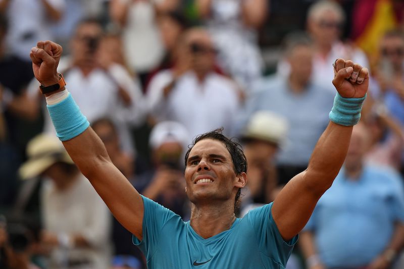 Rafael Nadal celebrates after victory over Austria's Dominic Thiem during their men's singles final match on day fifteen of The Roland Garros 2018 French Open tennis tournament in Paris.