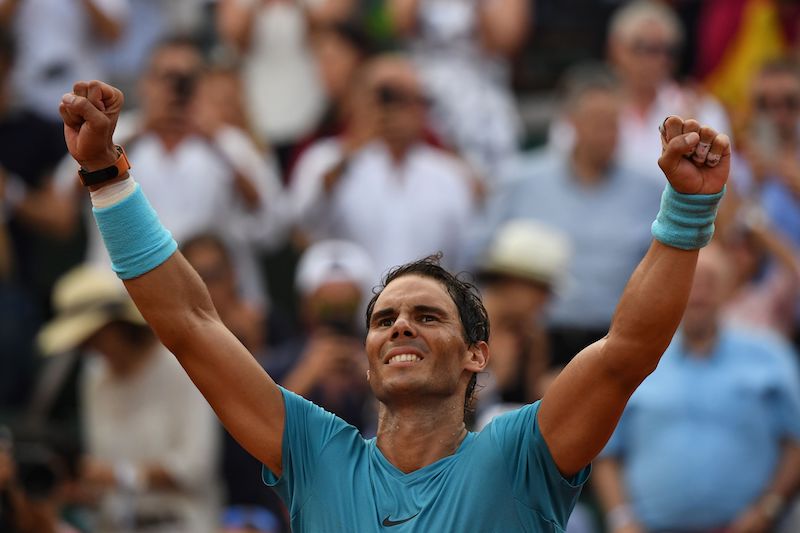 Rafael Nadal celebrates after victory over Austria's Dominic Thiem during their men's singles final match on day fifteen of The Roland Garros 2018 French Open tennis tournament in Paris. Rafael Nadal celebrates after victory over Austria's Dominic Thiem during their men's singles final match on day fifteen of The Roland Garros 2018 French Open tennis tournament in Paris.