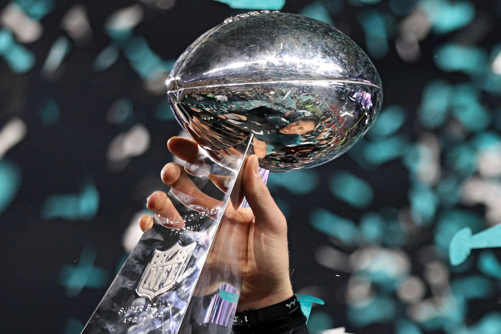 Quarterback Nick Foles #9 of the Philadelphia Eagles raises the Vince Lombardi Trophy