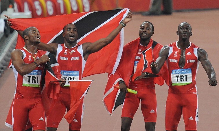 Trinidad and Tobago's Keston Bledman, Emmanuel Callender, Richard Thompson and Marc Burns celebrate after winning silver in the men's 4x100m Relay final at the National Stadium during the 2008 Beijing Olympic Games on August 22, 2008.