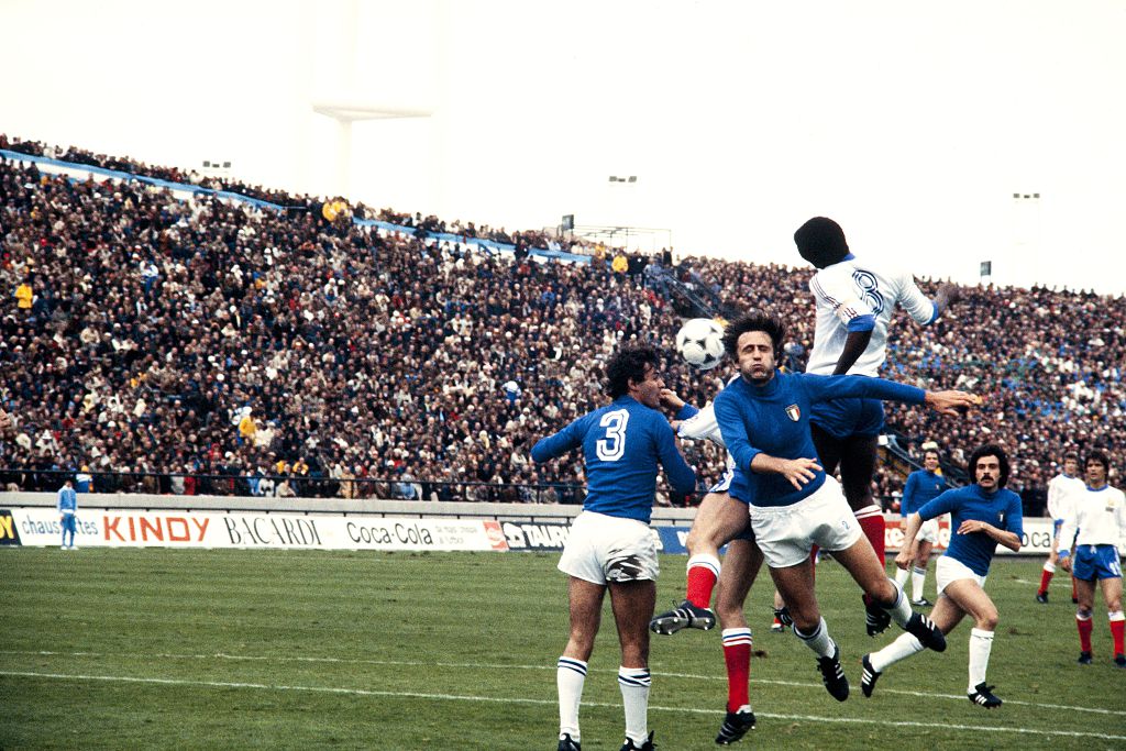 Antonio Cabrini (left) defends for Italy's soccer team