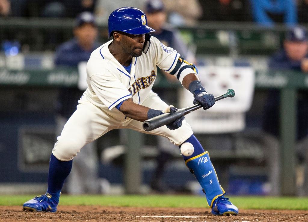 Seattle Mariners outfielder Guillermo Heredia squares up to lay down a sacrifice bunt