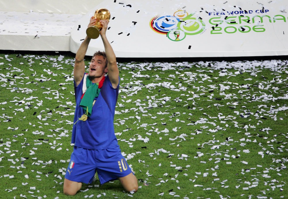 Italian midfielder Francesco Totti celebrates with the trophy after the World Cup 2006 final football game