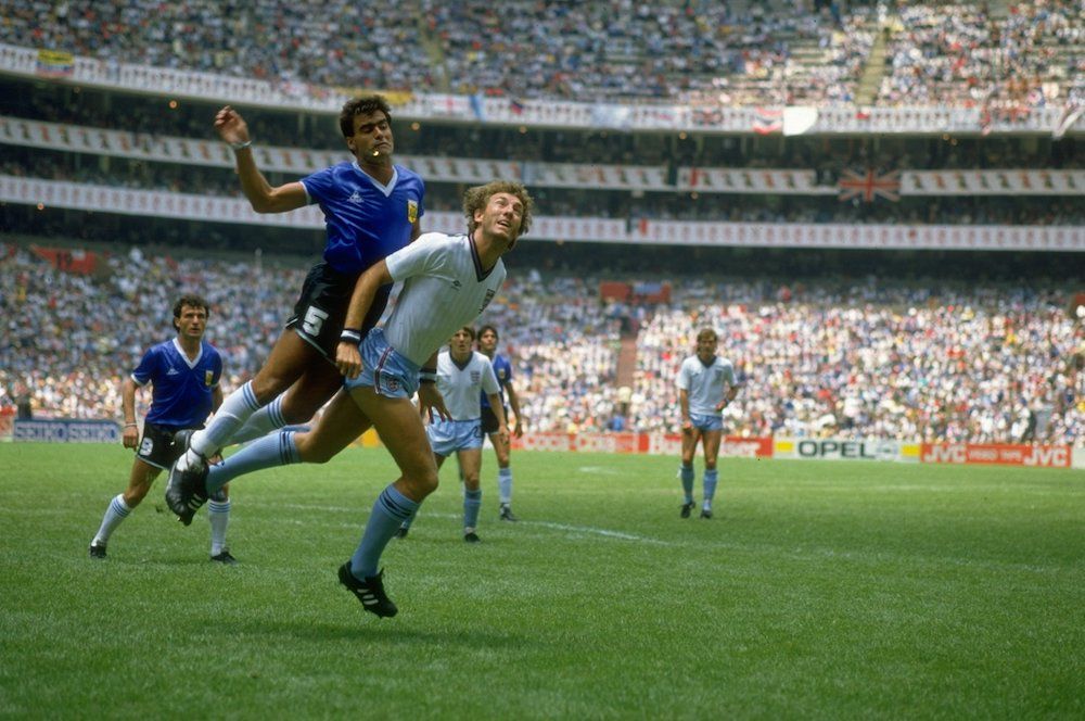 Jose-Luis Brown of Argentina tangles with Terry Butcher of England during the World Cup quarter-final in 1986