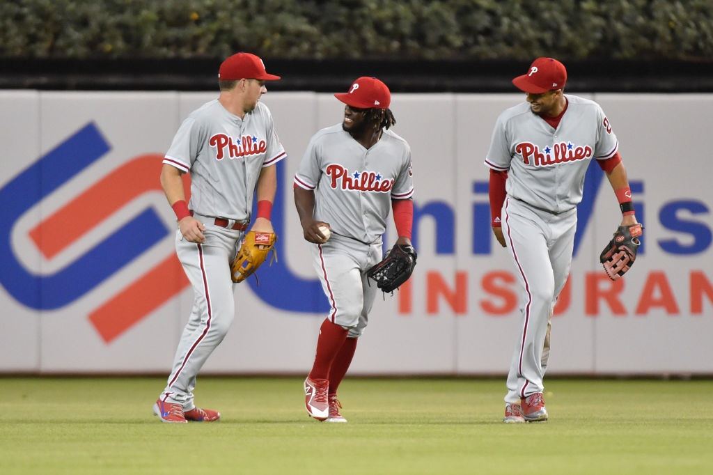 Philadelphia Phillies outfielders (from left) Rhys Hoskins, Odubel Herrera, and Aaron Altherr 