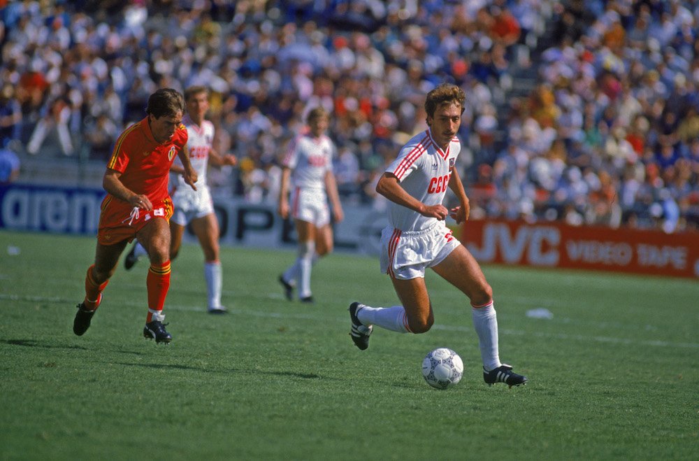 Sergei Aleinikov of the Soviet Union (right) is pursued by Daniel Veyt of Belgium in their World Cup second round match in 1986