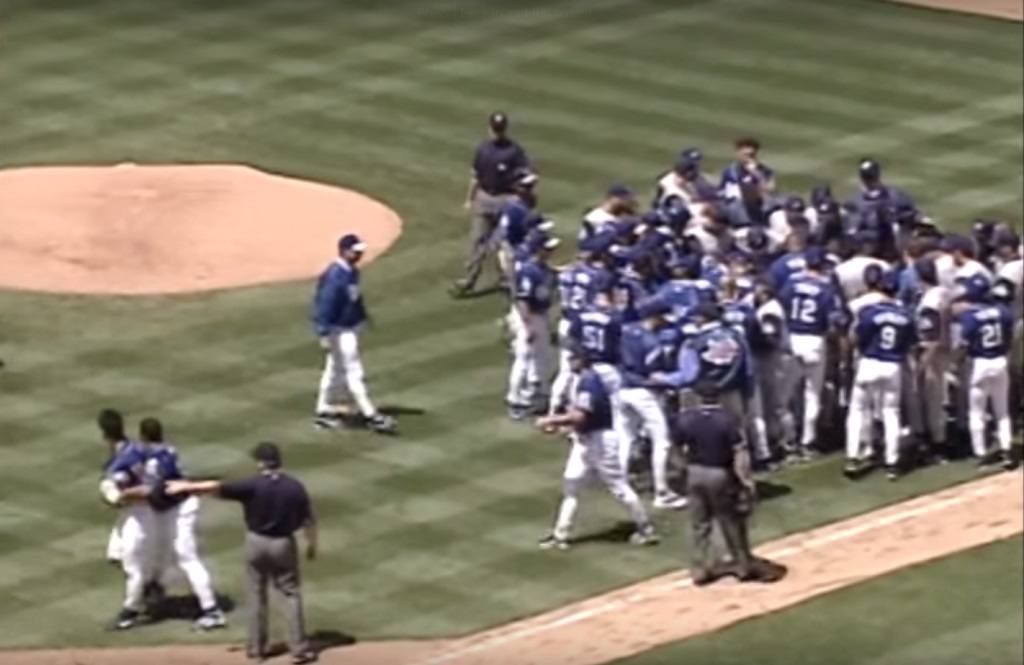 Pitcher Chan Ho Park (bottom left) is escorted away from a bench-clearing brawl he started with Tim Belcher