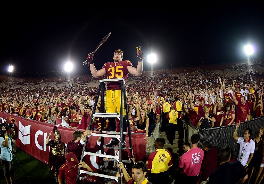 Cameron Smith leads Trojans fans in celebration after a USC victory Cameron Smith leads Trojans fans in celebration after a USC victory