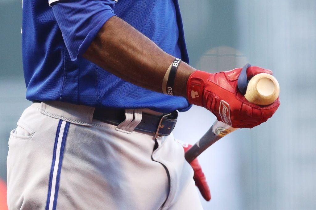 Teoscar Hernandez of the Toronto Blue Jays adjusts his gloves