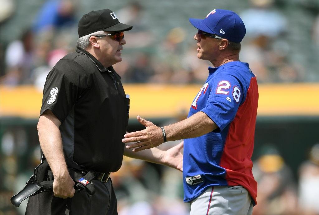 Manager Jeff Banister of the Texas Rangers argues with home plate umpire Bill Welke