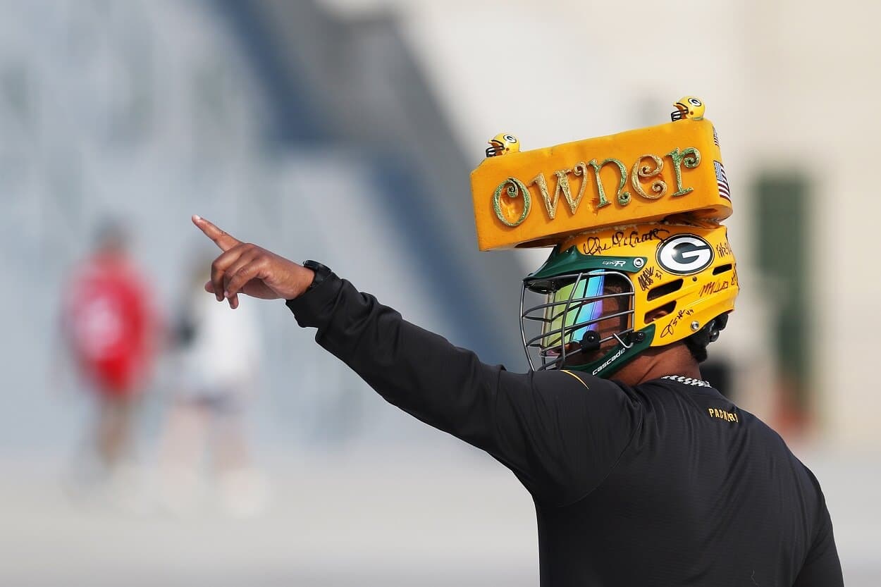 A Green Bay Packers owner waves to the crowd during 2021 Green Bay Packers Training Camp at Ray Nitschke Field on July 28, 2021