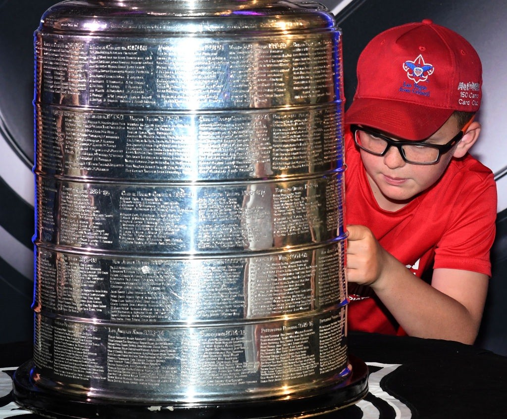 A young fan gets an up-close look at the Stanley Cup