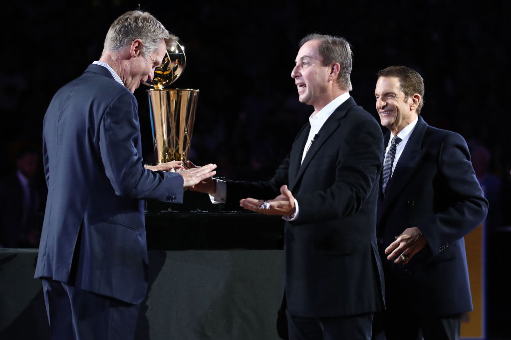 You could join Joe Lacob (middle) as a part owner of the Golden State Warriors -- if you have millions of dollars, that is.