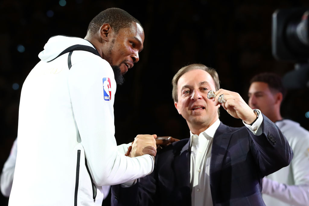 Joe Lacob (right) promised that no one will wear Kevin Durant's No. 35 Golden State Warriors jersey anytime soon.