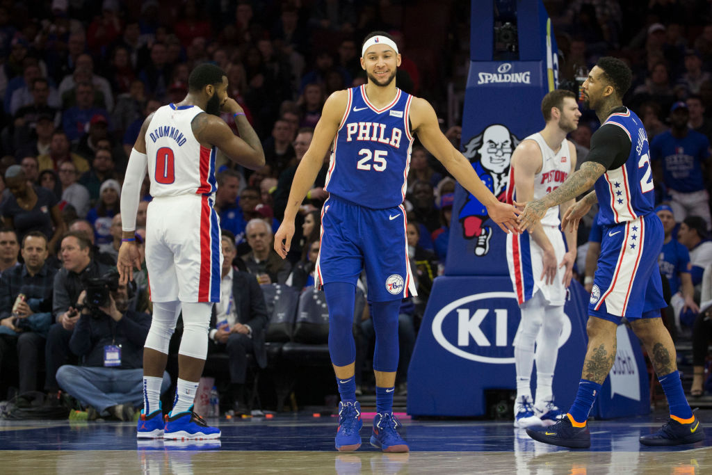 Ben Simmons high-fives his teammate